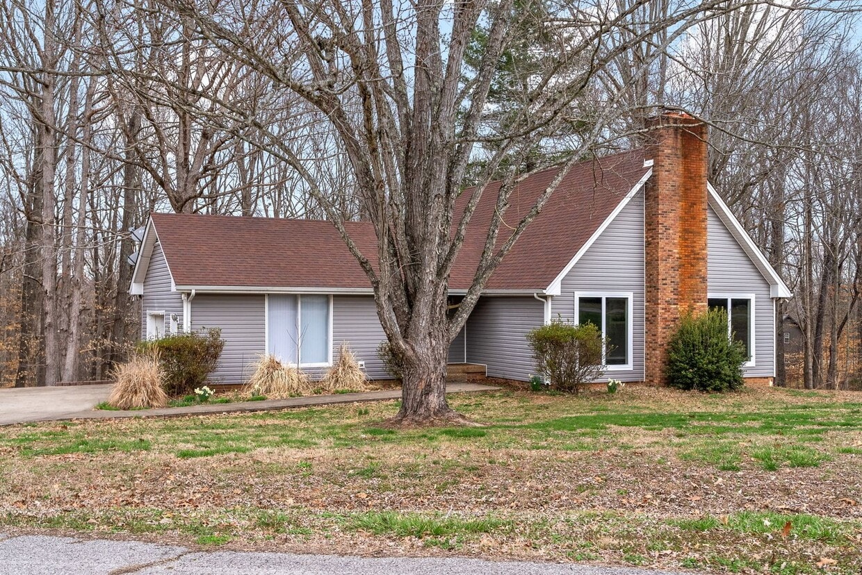 Primary Photo - Lovely home on beautiful wooded corner lot