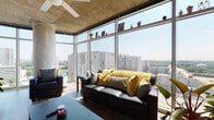 This single-floor urban unit is defined by its striking industrial-modern architecture, highlighted by exposed concrete ceilings, a ceiling fan in the living area, and expansive floor-to-ceiling glass windows that frame sweeping city skyline views. The open-plan living and kitchen area is bathed in natural light, with the kitchen offering stainless steel appliances, two-tone cabinetry, a tile backsplash, and a seamless flow into the living space. The living room features a corner glass wall arrangement that maximizes panoramic views and fills the space with sunlight throughout the day.

The hallway connects multiple bedrooms, each with its own character. One bedroom benefits from dramatic floor-to-ceiling windows overlooking the cityscape, while others incorporate creative personal touches, including wall-mounted plant shelves, art displays, and dedicated workspace areas with city views. Two full bathrooms feature light wood-look tile flooring, modern vanities with dark wood cabinetry, and tub-shower combinations. A built-in storage unit anchors the hallway, complemented by hardwood-style flooring throughout the common areas, creating a cohesive and functional living environment.