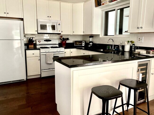 Kitchen with Bar Stools & Wine Fridge - 1535 18th St
