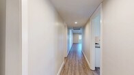 Located in the heart of Los Angeles on Weddington Street, this well-appointed 4-bedroom, 2-bathroom residence offers generous single-floor living across a thoughtfully designed layout. The open-concept living room is bright and welcoming, featuring warm wood-look flooring, recessed lighting, and a sliding glass door that invites natural light and outdoor access. The modern kitchen is outfitted with crisp white shaker cabinetry, sleek grey countertops, stainless steel appliances including a gas range, microwave, refrigerator, and dishwasher, all set atop matching wood-look flooring for a cohesive aesthetic. The four bedrooms are generously sized, with the expansive primary bedroom offering ample space and access to a walk-in closet with built-in shelving. Bedrooms feature plush carpeting and large windows that allow natural light to fill each room. The primary bathroom is well-appointed with a white vanity, grey countertop, wood-look flooring, a glass-enclosed shower, and a soaking tub. A second full bathroom features a tub-shower combo with clean, bright finishes. Four hallways connect the layout efficiently, and two closets provide practical storage. The overall ambiance is clean, modern, and move-in ready.