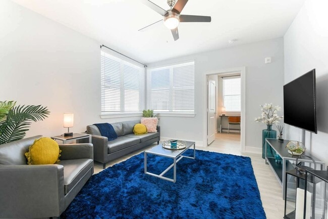 Living Room with 55" Smart TV - Buffalo at Arlington  