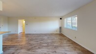 Located at 835 Mix Ave, Unit 415 in Hamden, CT, this one-bedroom, one-bathroom residence offers a well-designed single-floor layout with a comfortable and functional living environment. Durable hardwood-style flooring flows consistently throughout the unit, lending a clean, cohesive aesthetic to every room.

The open-concept kitchen and living area forms the heart of the home. The kitchen is outfitted with white shaker-style cabinetry, granite-look countertops, and a full suite of stainless steel appliances including a refrigerator, dishwasher, and electric range with an overhead ventilation hood. The adjacent living room is bright and spacious, featuring a large window that invites natural light and a sliding glass door that opens to a private balcony with outdoor views.

The bedroom is generously sized, offering a wide louvered double-door closet for ample storage and a window that provides additional natural light. The bathroom features a full tub-shower combination with elegantly tiled marble-patterned subway tile surrounds and chrome fixtures, creating a polished, contemporary feel.

A hallway connects the rooms efficiently, completing the thoughtful layout of this well-appointed residence in Hamden, Connecticut.