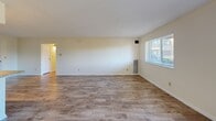 Located at 835 Mix Ave, Unit 415 in Hamden, CT, this one-bedroom, one-bathroom residence offers a well-designed single-floor layout with a comfortable and functional living environment. Durable hardwood-style flooring flows consistently throughout the unit, lending a clean, cohesive aesthetic to every room.

The open-concept kitchen and living area forms the heart of the home. The kitchen is outfitted with white shaker-style cabinetry, granite-look countertops, and a full suite of stainless steel appliances including a refrigerator, dishwasher, and electric range with an overhead ventilation hood. The adjacent living room is bright and spacious, featuring a large window that invites natural light and a sliding glass door that opens to a private balcony with outdoor views.

The bedroom is generously sized, offering a wide louvered double-door closet for ample storage and a window that provides additional natural light. The bathroom features a full tub-shower combination with elegantly tiled marble-patterned subway tile surrounds and chrome fixtures, creating a polished, contemporary feel.

A hallway connects the rooms efficiently, completing the thoughtful layout of this well-appointed residence in Hamden, Connecticut.