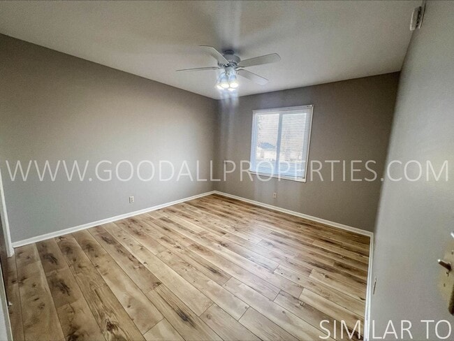 Building Photo - Ground-level condo featuring 2 bedrooms and 1 full bathroom, along with a detached garage.