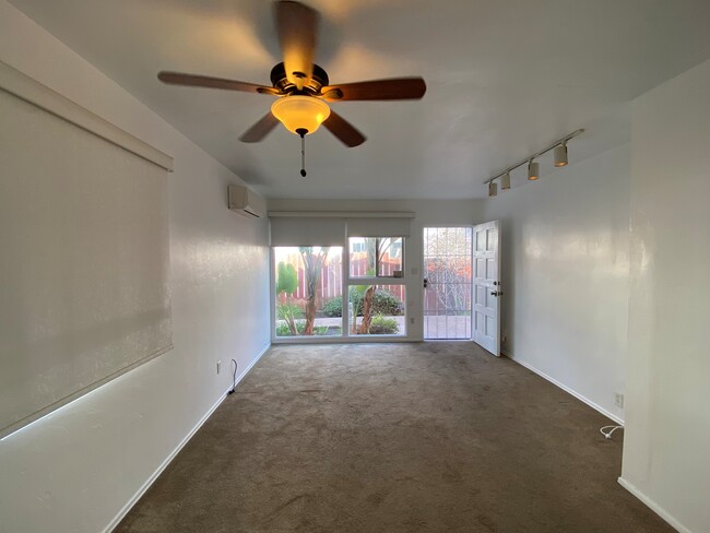 Living room looking out front windows and door - 1976 Missouri St