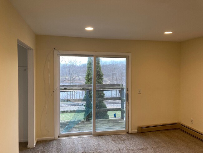 Front Bedroom with balcony overlooking river - 506 W Hydraulic St