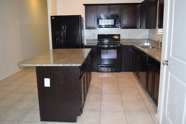 Building Photo - Excellent price on this 4 bedroom with Upgraded kitchen!