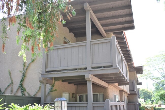Building Photo - Upper-Level Condo with Vaulted Ceilings & Granite Finishes