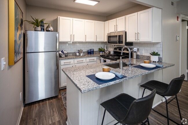 Kitchen with granite counters and stainless appliances - Alden