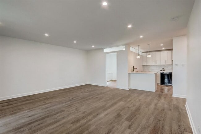 Living room with recessed lights, opens directly to kitchen! - 240 M St SW Apartment
