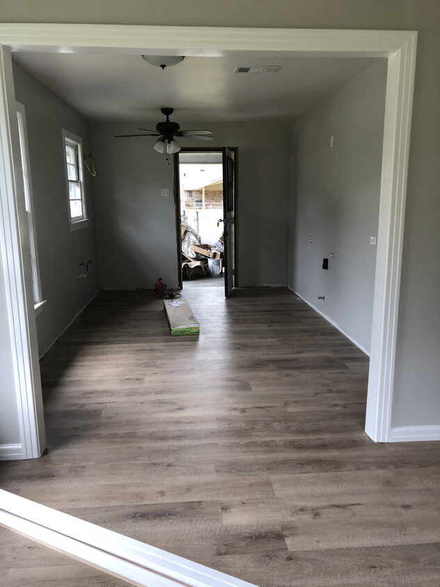 Shows kitchen and breakfast room from living room. Open floorplan with lots of natural light. - 601 Eason Pl