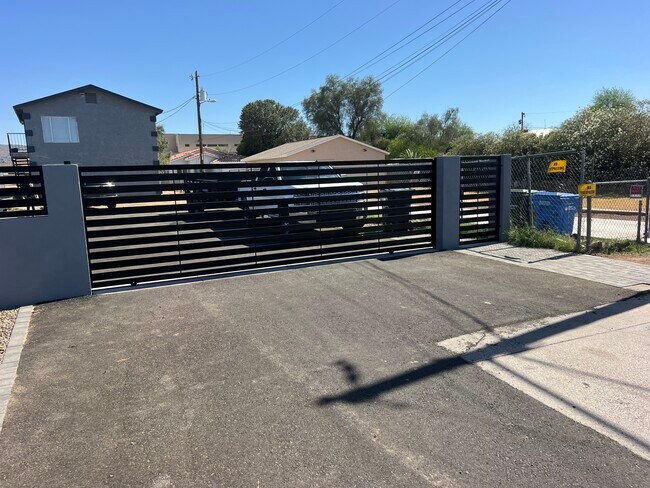 Front Gate & Vehicle Entrance - 841 E Roeser Rd Apartments