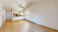 Located at 1107 Porter Street in Vallejo, CA, this well-appointed 1-bedroom, 1-bathroom home offers a thoughtfully designed layout across a single floor. The open-concept living and dining area immediately impresses with soaring vaulted ceilings and a ceiling fan overhead, creating an airy, spacious feel. Light wood-look flooring runs throughout, complemented by large windows that invite abundant natural light. A sliding glass door leads to a private balcony, extending the living space outdoors. The kitchen is efficiently designed with crisp white shaker cabinets, clean white countertops, stainless steel appliances including a refrigerator, range, microwave, and dishwasher, plus a window above the sink for added brightness. The bedroom features plush carpeting, a ceiling fan, a natural light-admitting window, and a sliding-door closet for convenient storage. A hallway connects to an additional closet and dedicated laundry area. The bathroom is finished with a wide vanity, white cabinetry, chrome fixtures, and a large mirror. Baseboard heating is found throughout the main living areas, ensuring year-round comfort in this clean, move-in ready home.