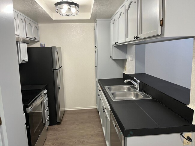 Building Photo - Cozy 2nd story apartment in the heart of City Heights.  Vaulted ceilings, fireplace, onsite laundry