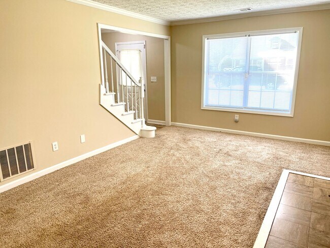Building Photo - Welcome to this charming 3-bedroom, 3-bath...