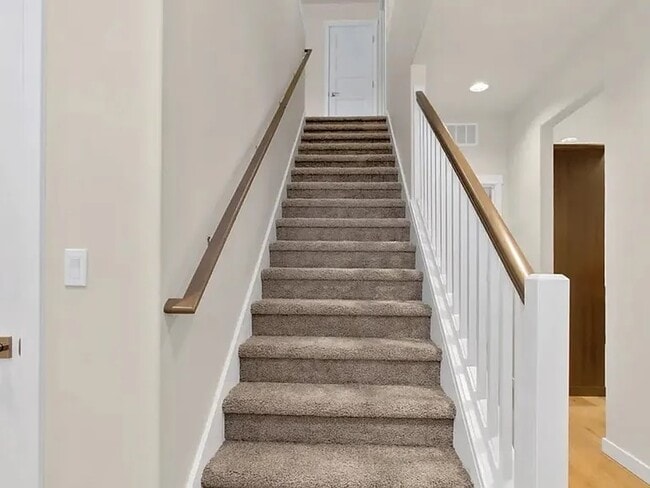 Staircase to upstairs - 711 Natalee Jo St SE
