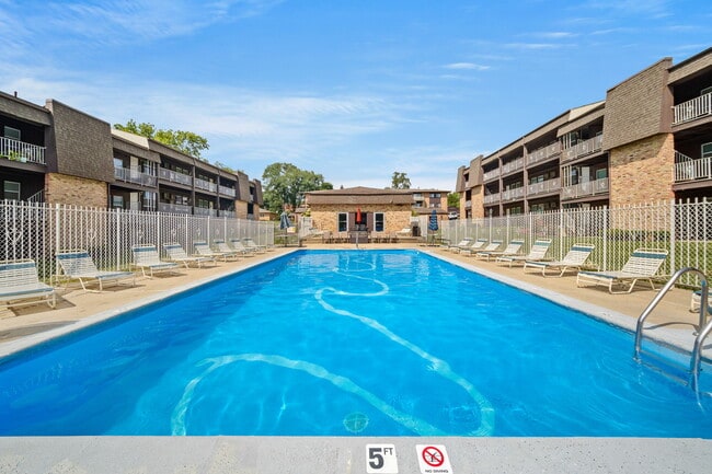 Outdoor Pool - Four Seasons Apartments