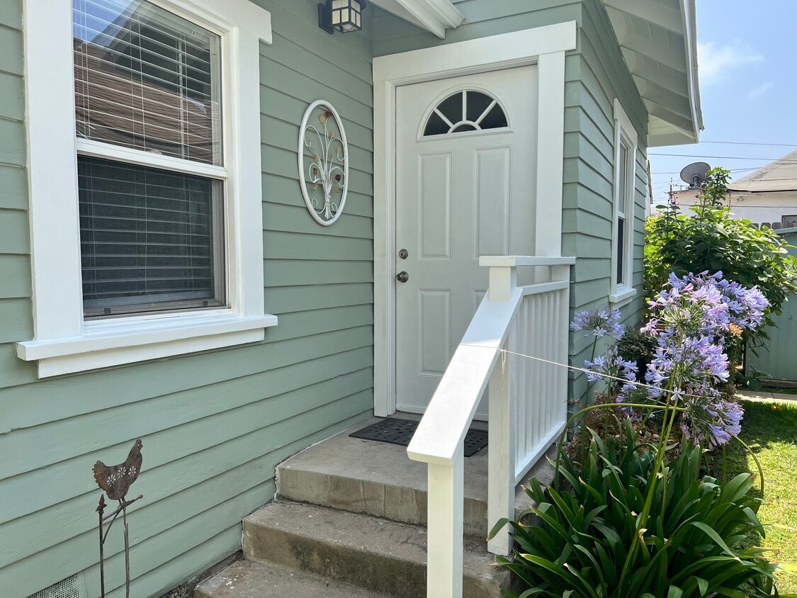 Small standalone cottage front door - 1819 10th St