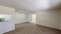 Located at 511 E Gibbsboro Rd in Lindenwold, New Jersey, this single-floor residence offers a straightforward and functional layout across several well-defined living spaces. The front entry opens into a generously sized living room, which features wall-to-wall carpet, a ceiling fan with light fixture, and a large front-facing window that allows natural light to fill the space. A secondary louvered closet and a pass-through shelf connect the living area to the kitchen, adding a practical, open feel between the two spaces. The kitchen is outfitted with white cabinetry, a gas range, dishwasher, and full-size refrigerator, all set atop durable tile flooring. Upper and lower cabinet storage provides ample room for organization. The bedroom is a quiet, carpeted retreat with a standard closet and a window overlooking the outdoors, providing natural light and ventilation. The bathroom features tile wainscoting, a tub-shower combination, and tile flooring, maintaining a clean and utilitarian design. Throughout the residence, neutral tones and white trim create a cohesive, move-in-ready aesthetic well-suited for comfortable everyday living.
