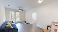 Located at 540 Richcrest Dr in Houston, Texas, this single-story, 3-bedroom, 2-bathroom home offers a well-designed layout with a comfortable and functional living environment. The kitchen is a standout feature, equipped with rich dark cabinetry, granite countertops, black appliances including a refrigerator, range, and microwave, and a peninsula with pendant lighting and bar seating — ideal for casual dining and entertaining. Wood-look flooring runs through the main living and kitchen areas, lending a clean, cohesive aesthetic. Each of the three bedrooms is finished with soft carpeting and ceiling fans, with windows dressed in layered curtains that allow natural light to filter in. The bedrooms also feature access to closets, including a walk-in closet with wire shelving for practical storage. Both bathrooms are appointed with granite-topped dark wood vanities, large mirrors, and tub-shower combinations with curtained surrounds. Wood-look tile flooring adds a polished touch to the bathrooms. Two dedicated closets provide additional storage throughout the home. The overall interior palette is light and neutral, with white walls and trim creating a bright, open feel across all rooms.