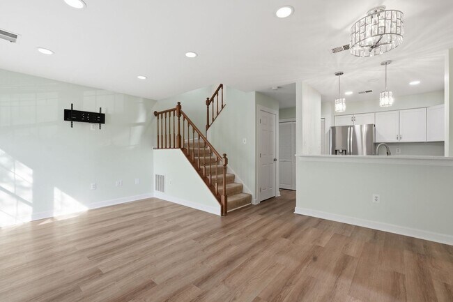 Building Photo - This exceptional home offers versatility, warmth, and elevated comfort across every level.