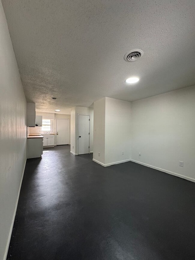Building Photo - This freshly repainted and refreshed single-story brick duplex- End Unit