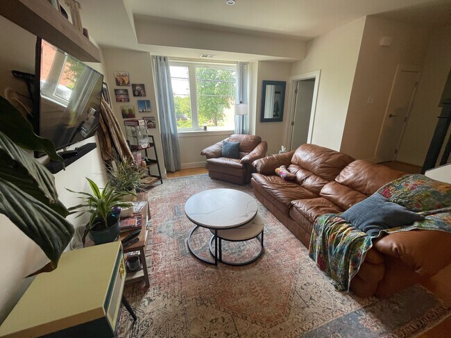 Living room and door to downstairs powder room - 3215 12th St NE