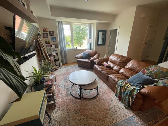 Living room and door to downstairs powder room - 3215 12th St NE