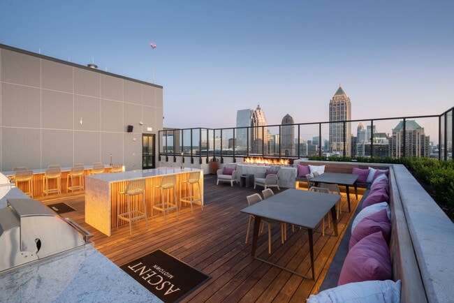 Rooftop lounge with outdoor kitchen, fireplace & spectacular views. - Ascent Midtown