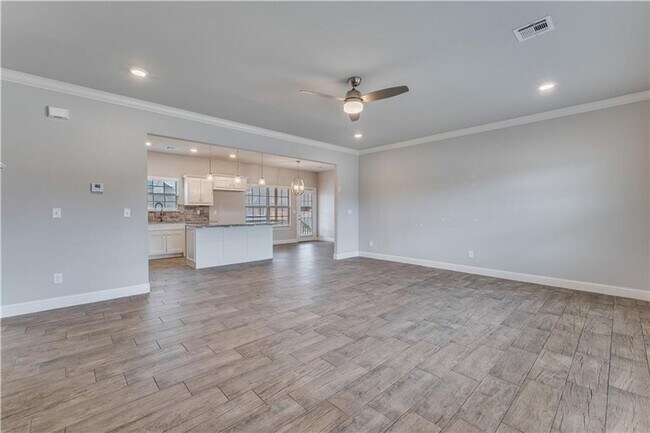 Building Photo - Minutes from I-49! 4BR/2.5BA Home