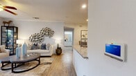 Located in Grapevine, TX, this well-appointed one-bedroom, one-bathroom residence offers a cohesive and comfortable layout across a single floor. Wood-style flooring and crown molding flow throughout, lending a warm, polished character to the space.

The open-concept kitchen and living area serves as the heart of the home. The kitchen features white cabinetry, granite countertops, stainless steel appliances including a refrigerator, range, and microwave, and a peninsula with a undermount sink — ideal for both everyday cooking and casual entertaining. The living room is bright and inviting, with a ceiling fan, crown molding, and sliding glass doors that open to a private balcony with views of the surrounding greenery.

The spacious bedroom accommodates a large bed comfortably, with natural light provided by a sizable window, a ceiling fan overhead, and easy access to a generous walk-in closet with wire shelving on multiple levels. The full bathroom is clean and well-finished, offering a granite-topped vanity with white cabinetry, a tub/shower combination with tile surround, and wood-style flooring. An in-unit laundry area with side-by-side washer and dryer connections adds everyday convenience, completing this efficiently designed and move-in-ready residence.