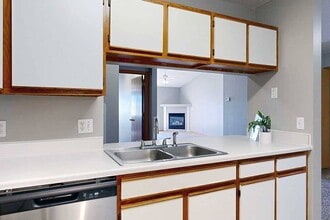 Kitchens in our Glacier homes feature an opening into the living room. - Northbrook Apartments