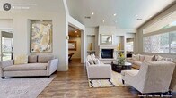 The Emerald Point Clubhouse at 2508 Gold Circle in Rocklin, California is a thoughtfully designed single-story community facility that serves as a central gathering hub for residents. The grand entry foyer sets an impressive tone with its soaring vaulted ceiling, arched transom windows, and glass double doors that flood the space with natural light. Neutral-toned sofas flank the entryway on polished tile flooring, creating a welcoming first impression.

Beyond the foyer, the clubhouse opens into a series of comfortable lounge and seating areas featuring patterned carpet, leather accent chairs, and built-in cabinetry with display shelving. An elegant glass-paned interior door connects these areas, accented by an arched wall niche that adds architectural character.

A dedicated business area includes a workstation with computer equipment and casual seating on carpet flooring, with a glass door leading directly outdoors. The kitchenette is outfitted with stainless steel appliances, including a refrigerator, built-in microwave, and dishwasher, complemented by granite countertops, white cabinetry, and a decorative tile backsplash.

The fitness center is well-equipped with treadmills, ellipticals, a stationary bike, and a free-weight rack, all set on durable rubber flooring with ceiling fans overhead and mirrored walls. A restroom corridor with dual water fountains and tile flooring provides practical amenities for all visitors.