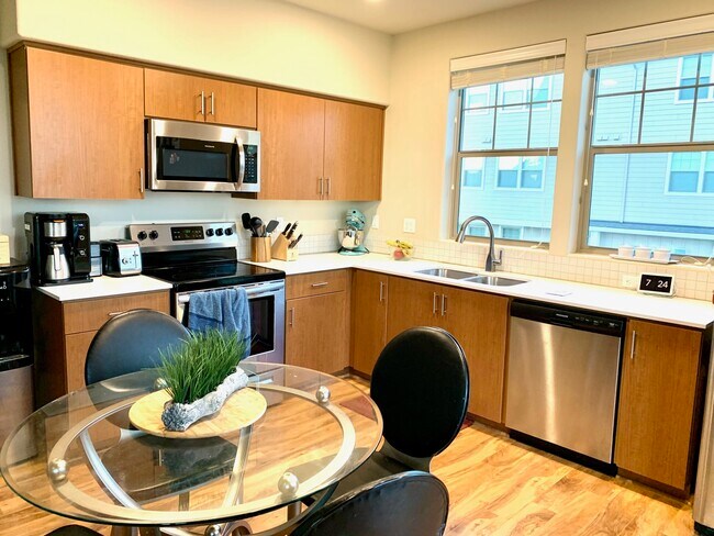 Quartz countertops and stainless steel appliances - 16417 NW Chadwick Way