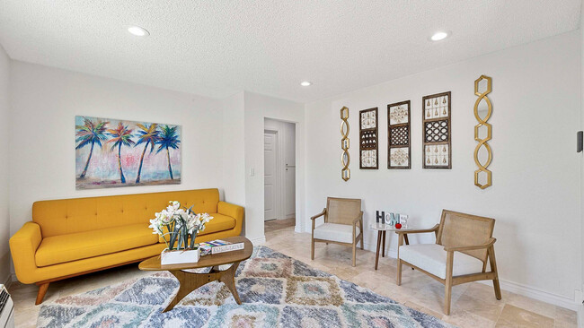 Experience comfort and style in this vibrant living room. - Residence at Sierra Vista