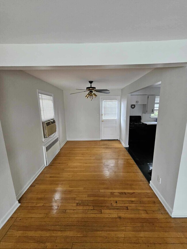 Dining area with entrance to yard and deck - 128 E Maple St