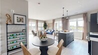 Located at 162 McCarthy Road West in Stratford, Ontario, this well-appointed 2-bedroom, 2-bathroom unit offers a thoughtfully designed single-level layout with modern finishes throughout. The open-concept kitchen and living area forms the heart of the home, featuring sleek grey cabinetry, stainless steel appliances, a white quartz-topped island with bar seating, a tile backsplash, and pendant lighting. Large windows flood the space with natural light and offer open outdoor views. The living room is generously proportioned, with light hardwood-style flooring, neutral walls, and ample space for relaxed seating arrangements. Both bedrooms are well-sized and bright, each featuring large windows with outdoor views. The primary bedroom offers a comfortable, serene retreat, while the second bedroom includes space for both sleeping and a workspace. The two bathrooms are finished with striking marble-look tile — one featuring a sleek glass-enclosed shower with a slate-toned vanity and black fixtures, and the other with a full soaker tub and clean white surrounds. Additional conveniences include an in-unit laundry room and a dedicated closet. The overall ambiance is contemporary and cohesive, blending cool grey tones with warm wood accents for a refined, modern aesthetic.