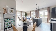 Located at 162 McCarthy Road West in Stratford, Ontario, this well-appointed 2-bedroom, 2-bathroom unit offers a thoughtfully designed single-level layout with modern finishes throughout. The open-concept kitchen and living area forms the heart of the home, featuring sleek grey cabinetry, stainless steel appliances, a white quartz-topped island with bar seating, a tile backsplash, and pendant lighting. Large windows flood the space with natural light and offer open outdoor views. The living room is generously proportioned, with light hardwood-style flooring, neutral walls, and ample space for relaxed seating arrangements. Both bedrooms are well-sized and bright, each featuring large windows with outdoor views. The primary bedroom offers a comfortable, serene retreat, while the second bedroom includes space for both sleeping and a workspace. The two bathrooms are finished with striking marble-look tile — one featuring a sleek glass-enclosed shower with a slate-toned vanity and black fixtures, and the other with a full soaker tub and clean white surrounds. Additional conveniences include an in-unit laundry room and a dedicated closet. The overall ambiance is contemporary and cohesive, blending cool grey tones with warm wood accents for a refined, modern aesthetic.