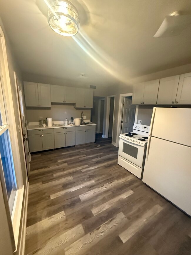 Kitchen New flooring cabinets and countertop - 502 W South St