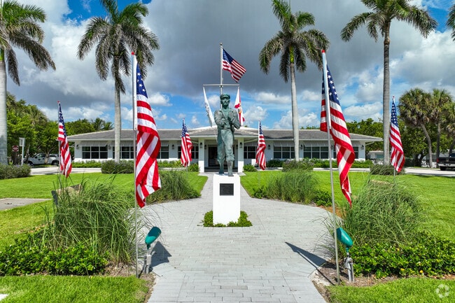 Capture a moment with The Barefoot Mailman Statue.