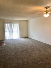 Living Room/Patio Door - Willow Creek Apartments