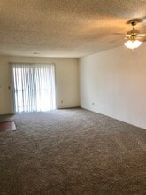 Living Room/Patio Door - Willow Creek Apartments