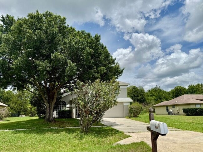 Building Photo - LARGE AND SPACIOUS 4/3 HOME IN EAST ORLANDO WEDGEFIED COMMUNITY