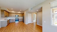 Located at 26222 Krameria in Moreno Valley, CA, this well-appointed 2-bedroom, 2-bathroom single-floor home offers a thoughtfully designed layout with clean, modern finishes throughout. The open-concept kitchen and living area serves as the heart of the home, showcasing warm wood-look laminate flooring, recessed lighting, and abundant natural light from multiple windows. The kitchen is well-equipped with light wood cabinetry offering generous storage, white quartz-style countertops, a stainless steel gas range with overhead microwave, dishwasher, and a full-size refrigerator — ideal for everyday cooking and entertaining. The spacious primary bedroom features plush carpeting, natural light from a large window, and direct access to a dedicated closet with built-in shelving rods, as well as an adjacent bathroom complete with a tub-shower combination and recessed lighting. The second bedroom also features carpet flooring and a bright window with outdoor views. The second bathroom mirrors the home's clean aesthetic with a tub-shower unit, wood vanity, and wood-look flooring. Neutral warm-beige tones and white trim are carried consistently throughout, creating a cohesive and inviting ambiance across the entire home.
