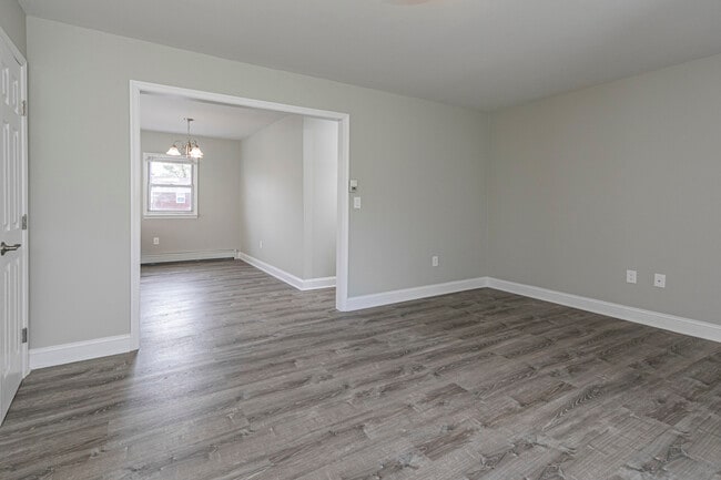 Modern grey composite flooring, luxurious molding and custom paint - Troy Hills Village