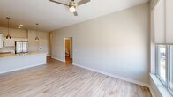 This 810 square foot apartment in Cedar Rapids, Iowa, offers a thoughtfully designed living space with modern amenities. The single-floor layout encompasses one bedroom, one bathroom, and an open-concept kitchen and living area. The primary bedroom, measuring 130 square feet, provides ample space and features carpeted flooring and large windows that allow natural light to flood the room.

The bathroom showcases a clean, contemporary design with a white vanity, toilet, and a combination tub-shower. Light-colored wood-look flooring extends throughout most of the apartment, creating a cohesive and spacious feel. The kitchen is a highlight, boasting white cabinetry, stainless steel appliances including a refrigerator, stove, and built-in microwave, as well as ample counter space.

The living area is open and versatile, with room for both dining and relaxation. Ceiling fans in the living room and bedroom provide additional comfort. A notable feature is the in-unit laundry area, complete with a stacked washer and dryer set, enhancing convenience for residents.

Large windows in the living spaces and bedroom offer views of the surrounding area and fill the apartment with natural light. The neutral color palette throughout provides a blank canvas for personal decorating styles. Overall, this apartment combines efficiency and modern design, making it an attractive option for those seeking a contemporary living space in Cedar Rapids.
