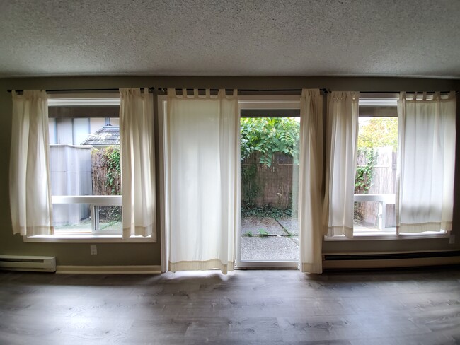 Private fenced in patio visible through windows - 9550 Interlake Ave N