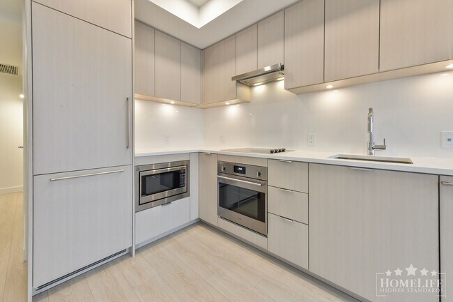 Photo du bâtiment - Modern 1-Bedroom Condo at The Flamingo. Brand-New, Bright, and Steps to Future Shops & Restaurants