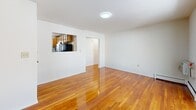 Located at 321 Crowells Rd in Highland Park, NJ, this well-maintained 2-bedroom, 1-bathroom residence offers a functional and comfortable layout across a single floor. Rich, gleaming hardwood floors run throughout the main living areas and bedrooms, lending warmth and continuity to the space.

The combined kitchen and living room area serves as the heart of the home. The living room is bright and open, featuring a sliding glass door that leads to a private balcony with outdoor views. The kitchen is thoughtfully equipped with warm honey-toned wood cabinetry, dark countertops, tile flooring, and a full suite of stainless steel appliances including a gas range, dishwasher, refrigerator, and microwave. A pass-through window connects the kitchen to the living area, enhancing the open feel.

Both bedrooms are finished with the same hardwood flooring and feature ceiling fans and windows that bring in natural light. The primary bedroom is generously sized with dual windows and a wall-mounted air conditioning unit. The second bedroom offers access to additional closet storage.

The bathroom is clean and straightforward, featuring a tiled tub-shower combination, tile flooring, and bright white finishes. A hallway connects the rooms efficiently, completing this practical and inviting floor plan.