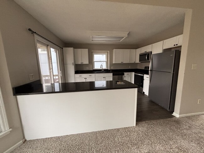 Building Photo - 3BR/2BA w/ Fenced Yard + Patio/Deck and 2-Car Garage in Olathe